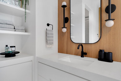 Inspiration for a mid-sized modern master brown tile and porcelain tile porcelain tile, beige floor, single-sink and wood wall bathroom remodel in Miami with flat-panel cabinets, white cabinets, a bidet, white walls, an undermount sink, quartz countertops, a hinged shower door, white countertops and a floating vanity