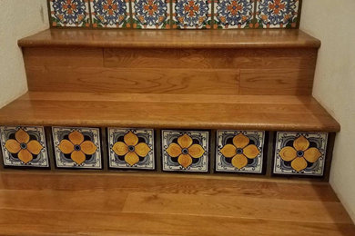 Trendy wooden straight staircase photo in Los Angeles with tile risers