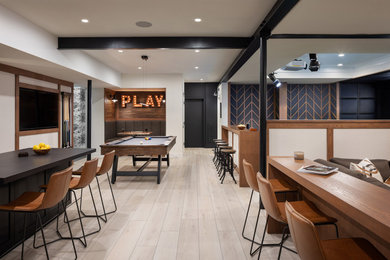 Game room - mid-sized transitional open concept medium tone wood floor game room idea in New York with white walls, no fireplace and no tv