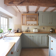 Pretty cabinet color.  Love the plate rack.