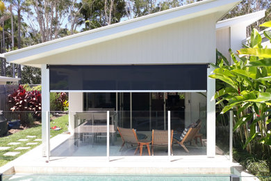 Inspiration for a mid-sized contemporary backyard patio in Sunshine Coast with an awning.