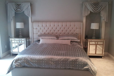 Example of a transitional master carpeted bedroom design in Toronto with gray walls