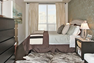 Design ideas for a mid-sized eclectic master bedroom in Toronto with beige walls, dark hardwood floors and no fireplace.