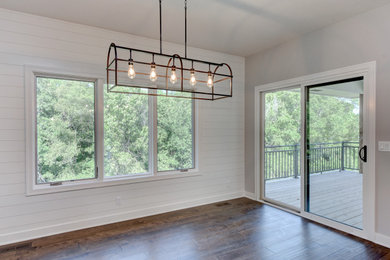 Inspiration for a farmhouse dark wood floor kitchen/dining room combo remodel in Omaha with white walls