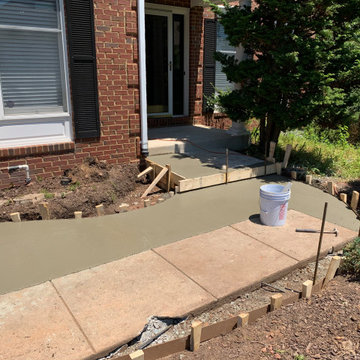 Limestone walkway with brick ascent to match house