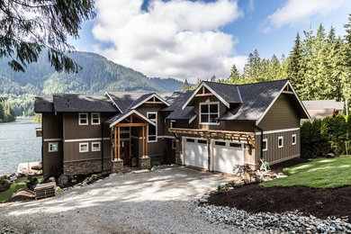 Large arts and crafts two-story mixed siding exterior home photo in Seattle