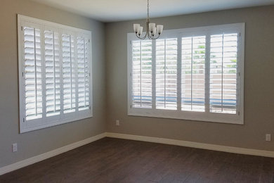 Elegant kitchen/dining room combo photo in Phoenix with brown walls