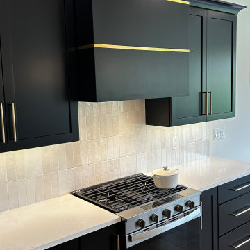 Black and Maple Wheat Kitchen with Brass Banded Hood