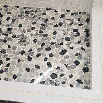 pebble shower floor with 3" curb