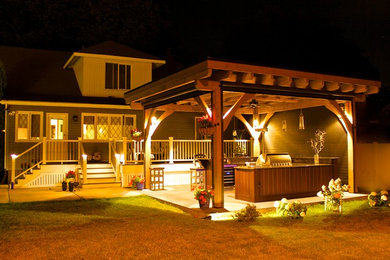 Large transitional one-story wood exterior home idea in Other