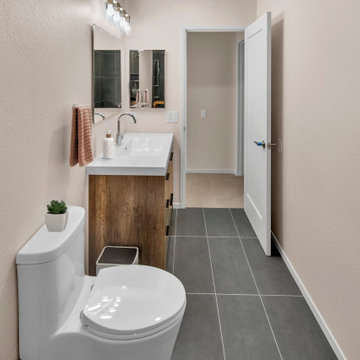 Modern Bathroom Refresh with Sleek Vanity and Contemporary Flooring