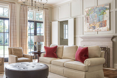 Large elegant open concept brown floor, coffered ceiling and wall paneling family room photo in Other with beige walls, a standard fireplace, a concrete fireplace and no tv