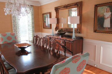 Inspiration for a large transitional light wood floor and brown floor enclosed dining room remodel in Other with beige walls and no fireplace