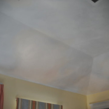 Clouds painted on ceiling in kids rooms