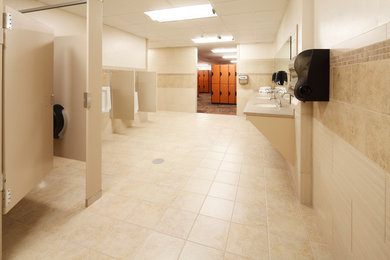 Example of a large classic beige tile and ceramic tile ceramic tile bathroom design in Other with a drop-in sink, quartz countertops and beige walls