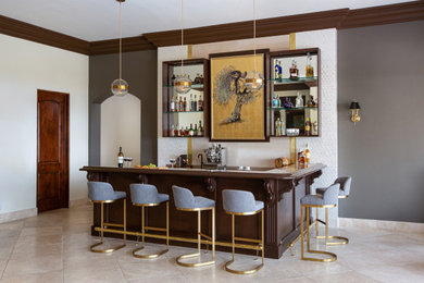 Seated home bar - mid-sized modern seated home bar idea in San Diego with dark wood cabinets, marble countertops and beige backsplash
