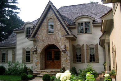 Large transitional beige two-story mixed siding house exterior idea in Boston with a hip roof and a shingle roof