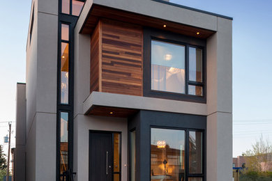 Mid-sized mountain style beige three-story mixed siding flat roof photo in Calgary