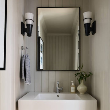 Powder Room with Shiplap Walls and Ceramic Console Sink