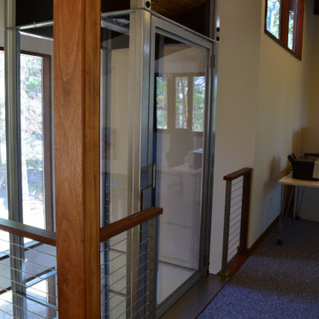 Boxborough Deck House with Modern Home Elevator