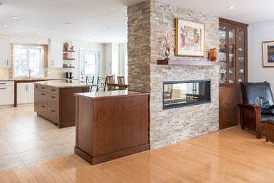Large transitional open concept light wood floor family room photo in Ottawa with beige walls, a two-sided fireplace and a stone fireplace