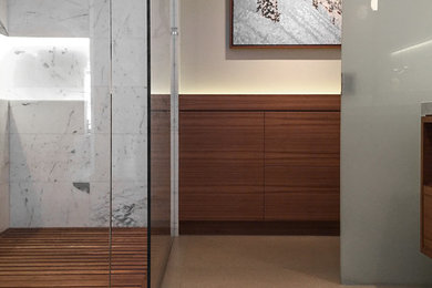 This is an example of a large modern master bathroom in Vancouver with flat-panel cabinets, medium wood cabinets, a curbless shower, gray tile, white tile, stone tile and beige walls.