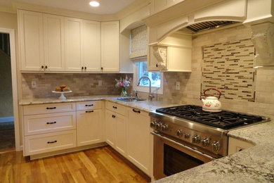 Example of a transitional kitchen design in New York