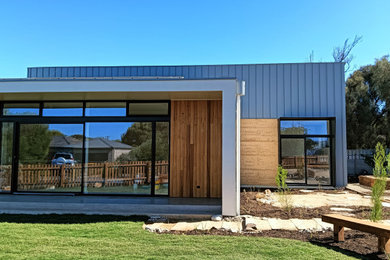 Photo of a beach style home design in Adelaide.