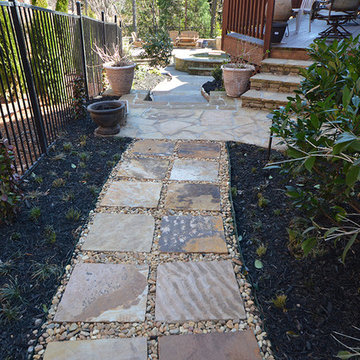 Stone work leading to backyard pool