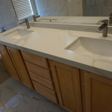 White gold and grey marble bathroom remodel