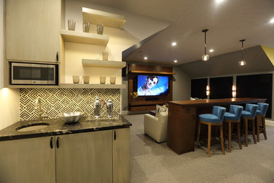 Inspiration for a mid-sized contemporary enclosed home theater remodel in Richmond with a media wall