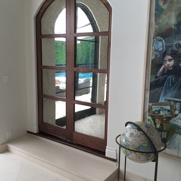 Arched Pocket Doors with Antique Mirror