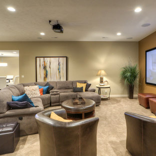 Inspiration for a traditional home cinema in Omaha with a projector screen.