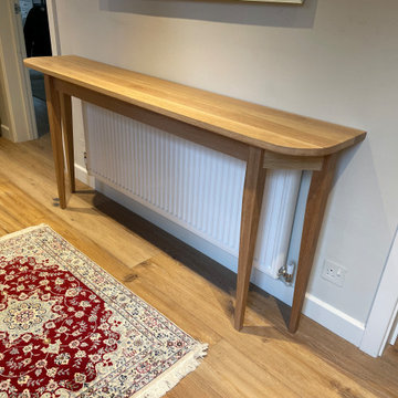 Tapered legged console table.