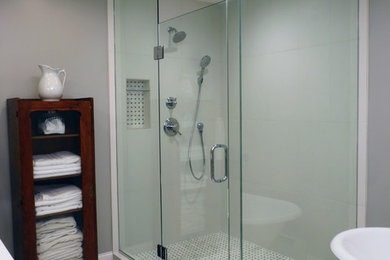 Photo of a large contemporary master bathroom in Minneapolis with a corner shower, white tile and marble floors.