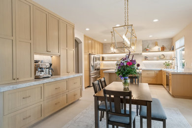 Large minimalist u-shaped porcelain tile and beige floor eat-in kitchen photo in San Diego with an undermount sink, shaker cabinets, light wood cabinets, quartzite countertops, white backsplash, stone slab backsplash, stainless steel appliances, an island and white countertops