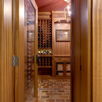 Secret passageway wine cellar. Basement layout with all mahogany racking.