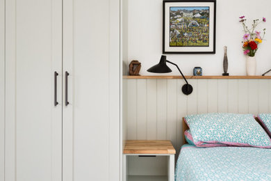 Photo of a medium sized contemporary bedroom in Hertfordshire with carpet and beige floors.