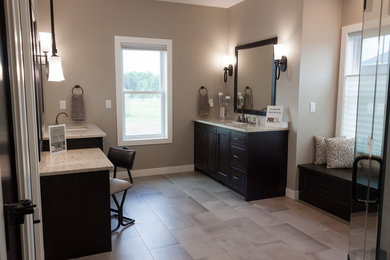 Large transitional master bathroom in Other with beaded inset cabinets, brown cabinets, an alcove shower, gray tile, porcelain tile, grey walls, porcelain floors, an undermount sink, engineered quartz benchtops, grey floor, a hinged shower door and multi-coloured benchtops.