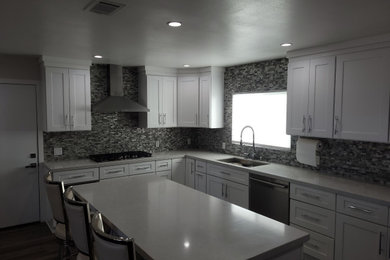 Example of a large minimalist u-shaped kitchen design in Los Angeles