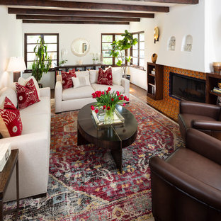 Design ideas for a mediterranean formal living room in Other with white walls, dark hardwood flooring, no tv, a ribbon fireplace and a tiled fireplace surround.