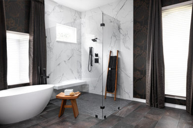 Bathroom - large transitional master white tile and porcelain tile porcelain tile, brown floor, double-sink and wallpaper bathroom idea in Austin with flat-panel cabinets, dark wood cabinets, a two-piece toilet, blue walls, an undermount sink, quartz countertops, white countertops and a floating vanity