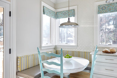 Cottage medium tone wood floor and brown floor dining room photo in Toronto with gray walls