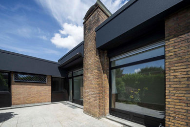 Mittelgroße Moderne Terrasse im Innenhof, im Erdgeschoss mit Markisen in Düsseldorf