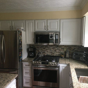 cabinet refacing--antique white with granite, backsplash, and flooring