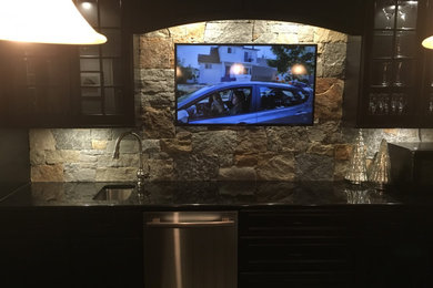 Example of a minimalist single-wall open concept kitchen design with stone slab backsplash and an island