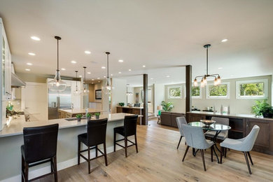 Mid-sized transitional light wood floor and beige floor great room photo in Denver with beige walls