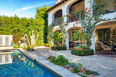 Inspiration for a mid-sized mediterranean concrete paver patio remodel in Los Angeles with no cover
