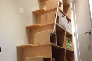 Inspiration for a small industrial straight metal railing staircase remodel in Little Rock