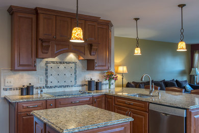 Inspiration for a mid-sized timeless u-shaped dark wood floor and brown floor eat-in kitchen remodel in Other with a single-bowl sink, raised-panel cabinets, medium tone wood cabinets, granite countertops, beige backsplash, stone tile backsplash, stainless steel appliances and an island